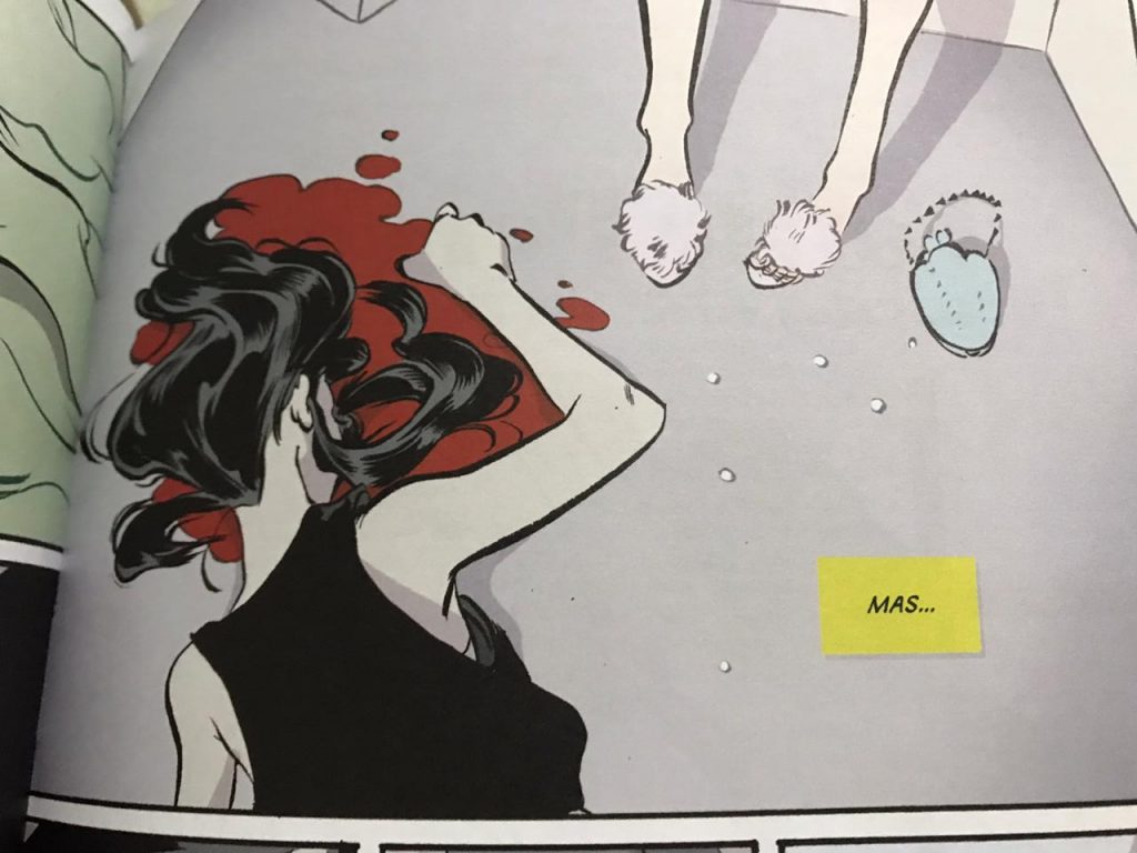 Uma moça no chão com sangue